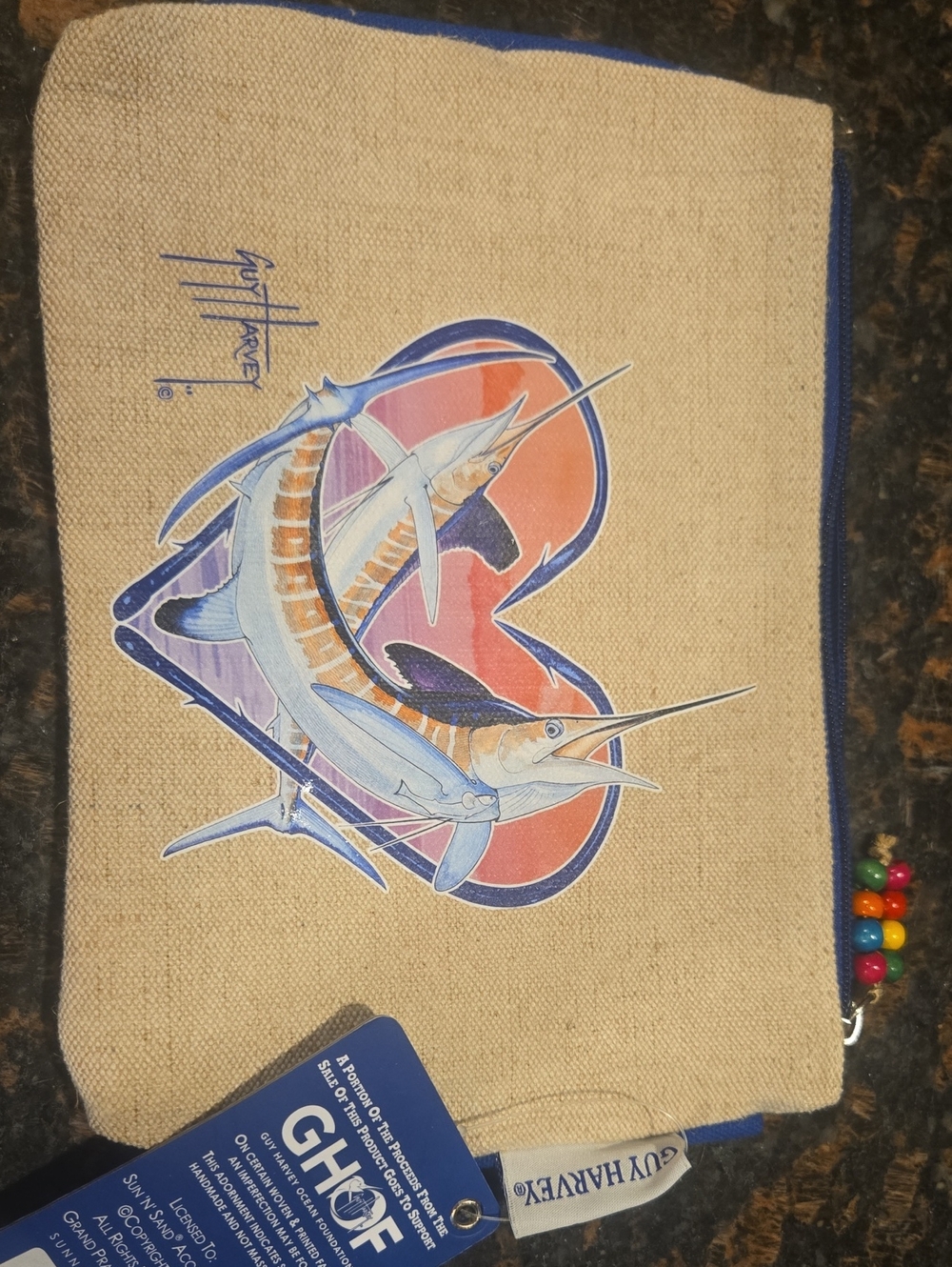 Guy Harvey branded zippered canvas pouch featuring a blue marlin artwork
